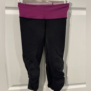 Lulu lemon womens cropped black & purple workout pants. Size 2.